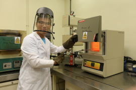 Dr He Binbin uses a furnace for tempering of steel.